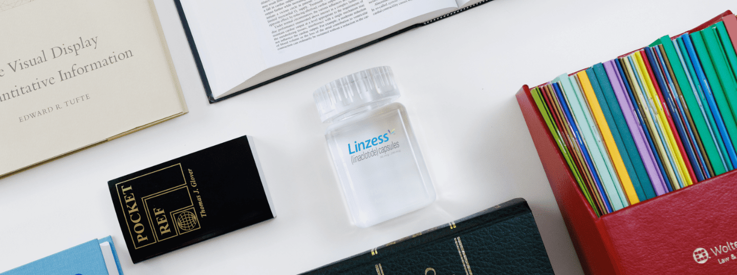 desk with Linzess product bottle