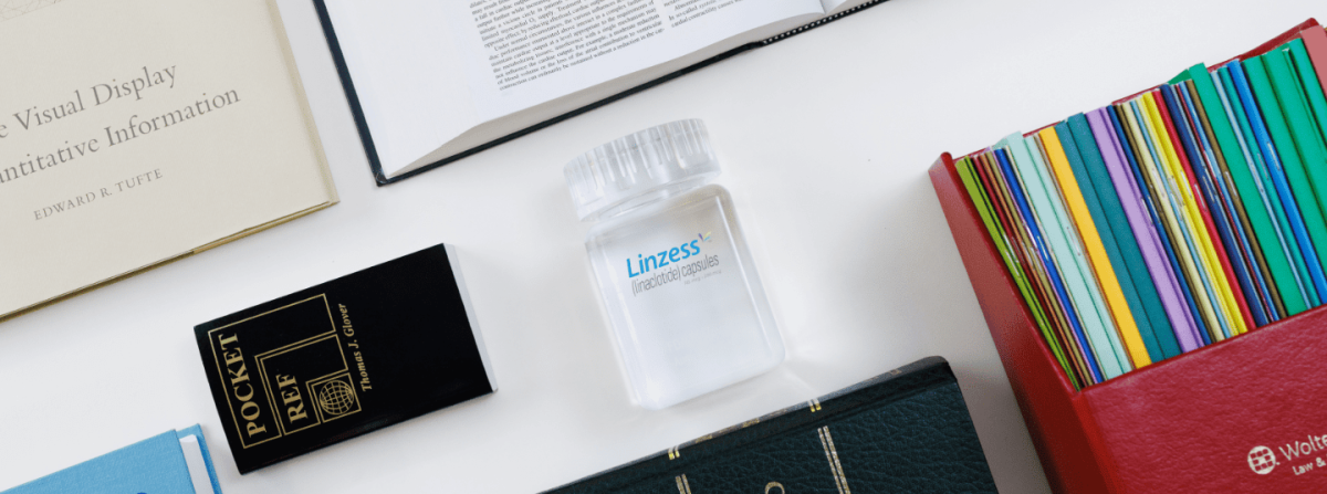 desk with Linzess product bottle