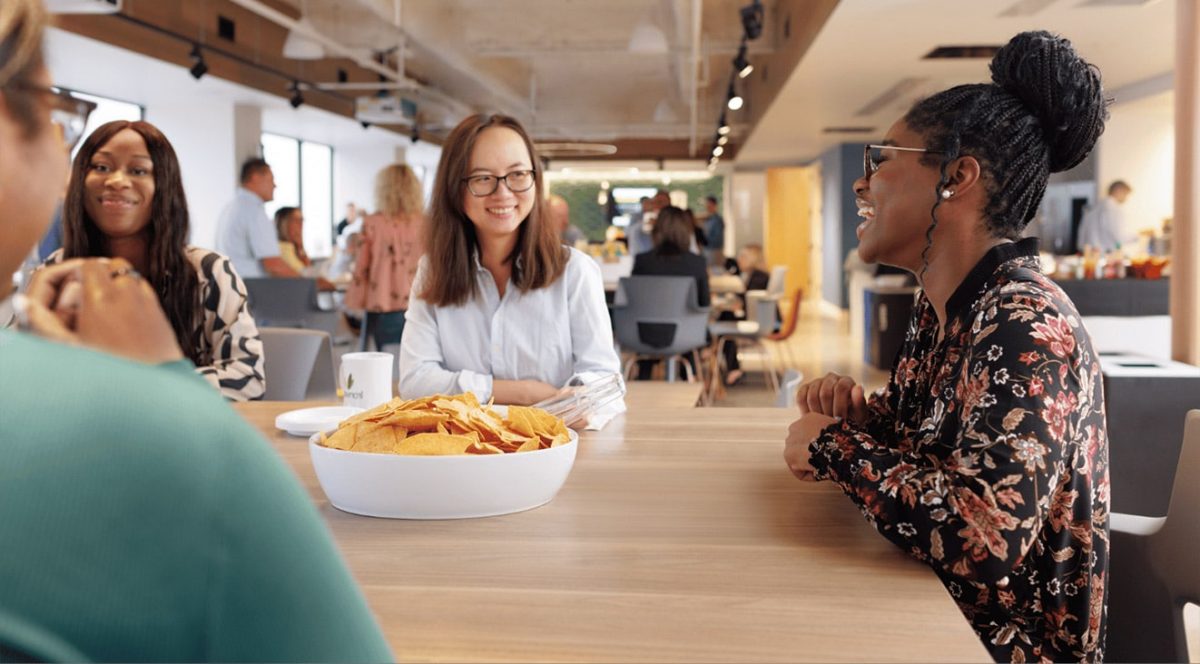 multicultural women talking at lunch