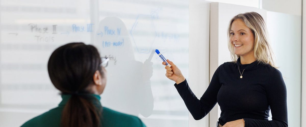 tow women conversing in a classroom