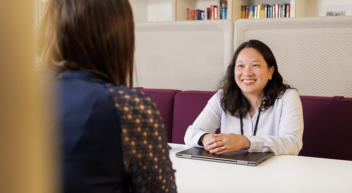 doctor conversing with a person over a table